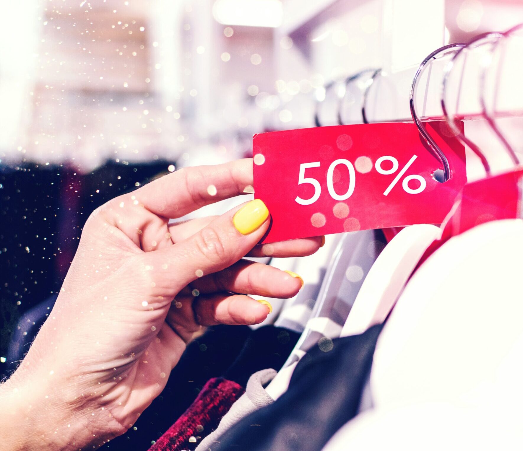 person holding red and white love print gift wrapper